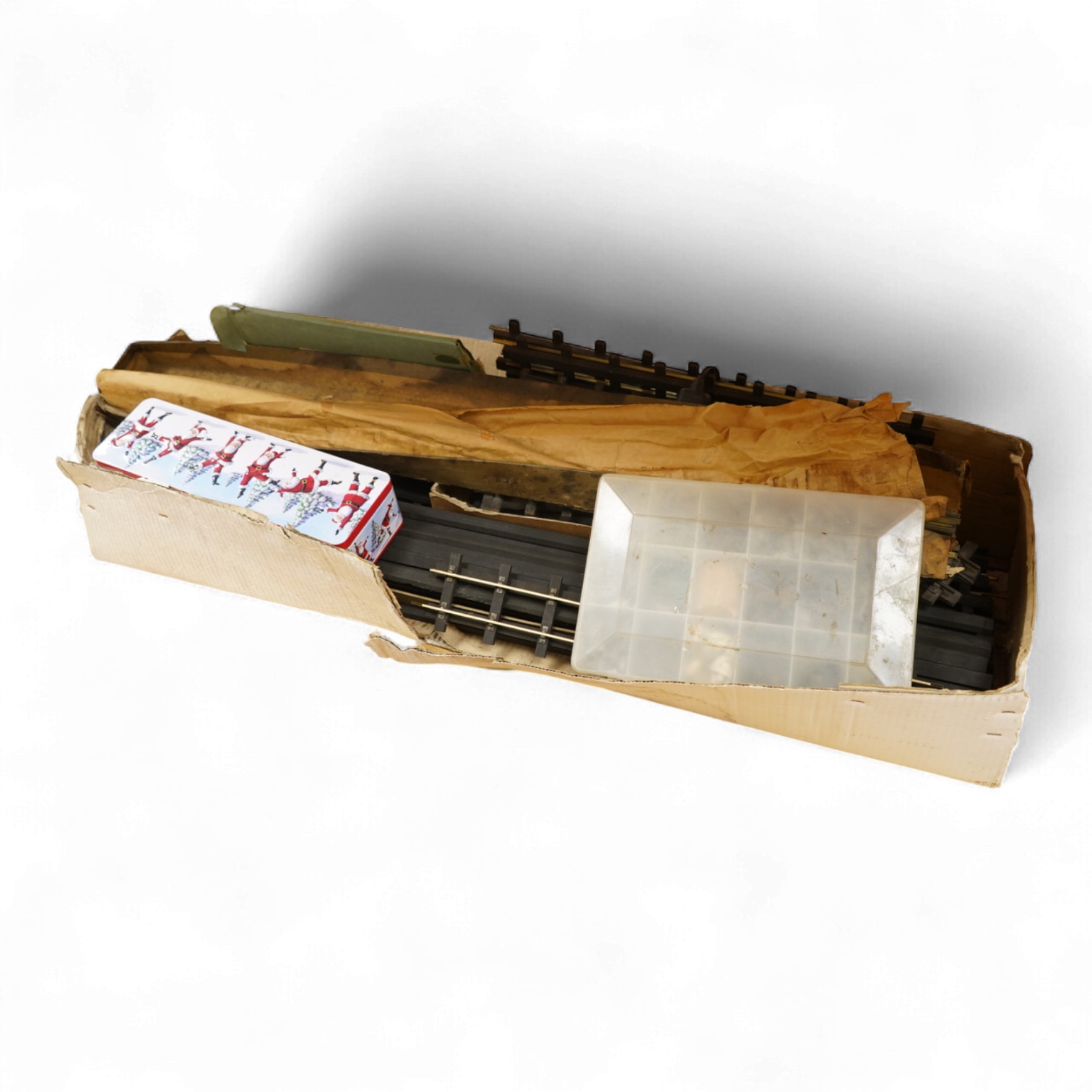 A quantity of 1930s-50s Bassett Lowke 0 gauge railway related track parts and accessories, including track sections on wooden sleepers, a Bassett-Lowke set of points, plus two handmade sets of points, track gauges, chair